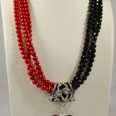 Red and black multi strand necklace with red heart pendant