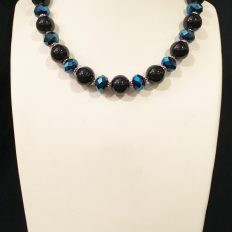 Blue faceted crystal and round jet glass necklace