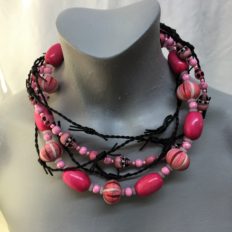 Pink skulls, large pink pumpkin beads and leather barbed wire
