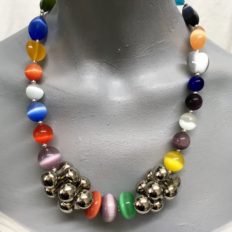 Variety of cats eye beads with large ‘peanut’ silver plated beads £35